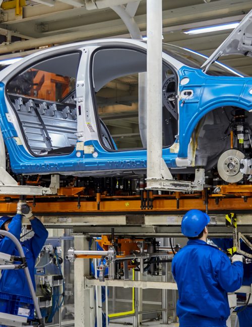 Shanghai, China, China - January 12, 2016: Workers are installing car chassis firmware on the production line of the Shanghai Volkswagen manufacturing workshop